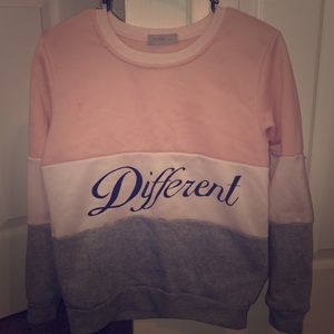 a pink,grey, and white ‘different’ sweater